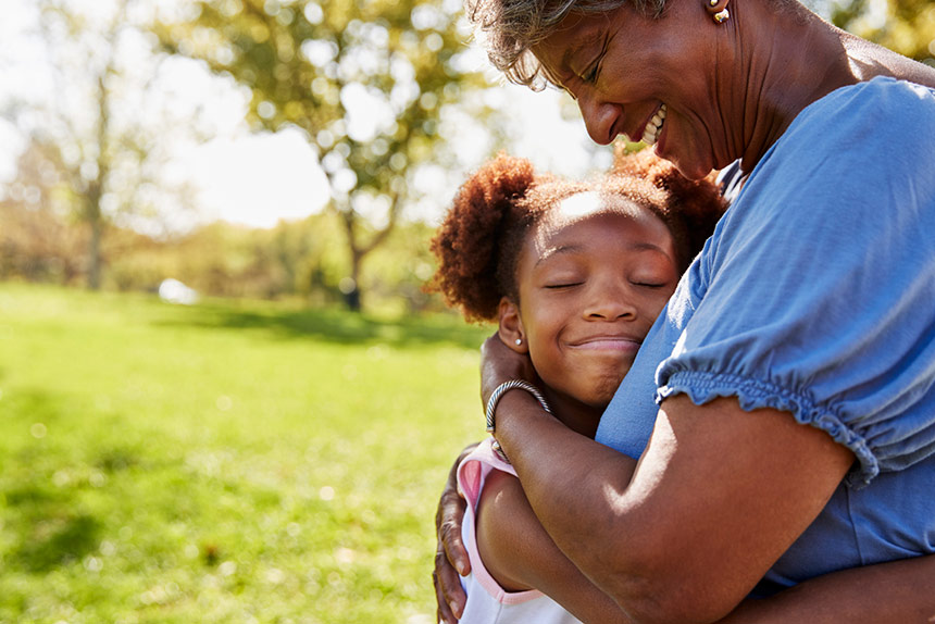 Grandmother hugging her granddaughter