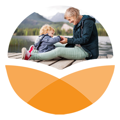 Orange stylized circle with photo in top portion of senior woman with toddler on a pier in the water