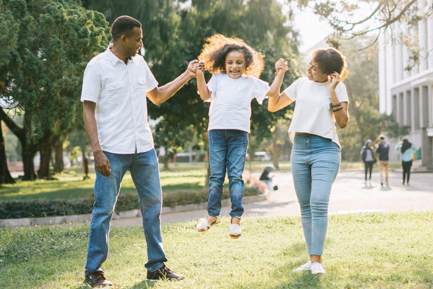 Photo of African American family playing outside