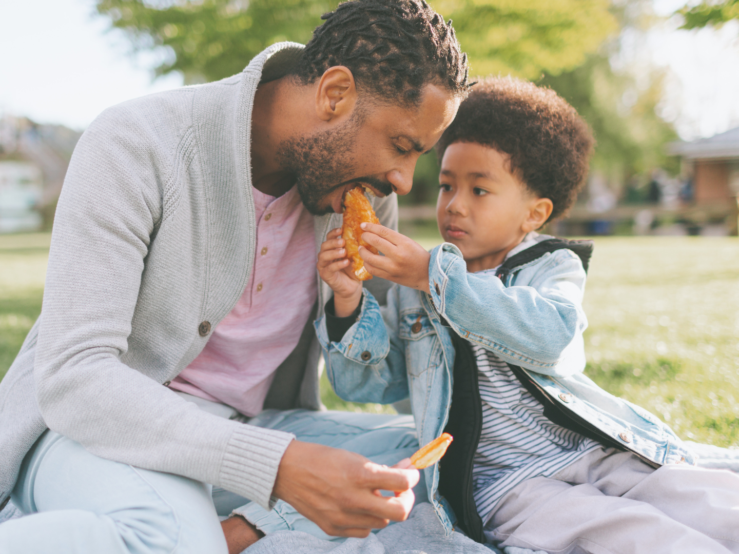 Father and son sharing a meal