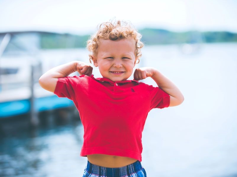 Child posing near water