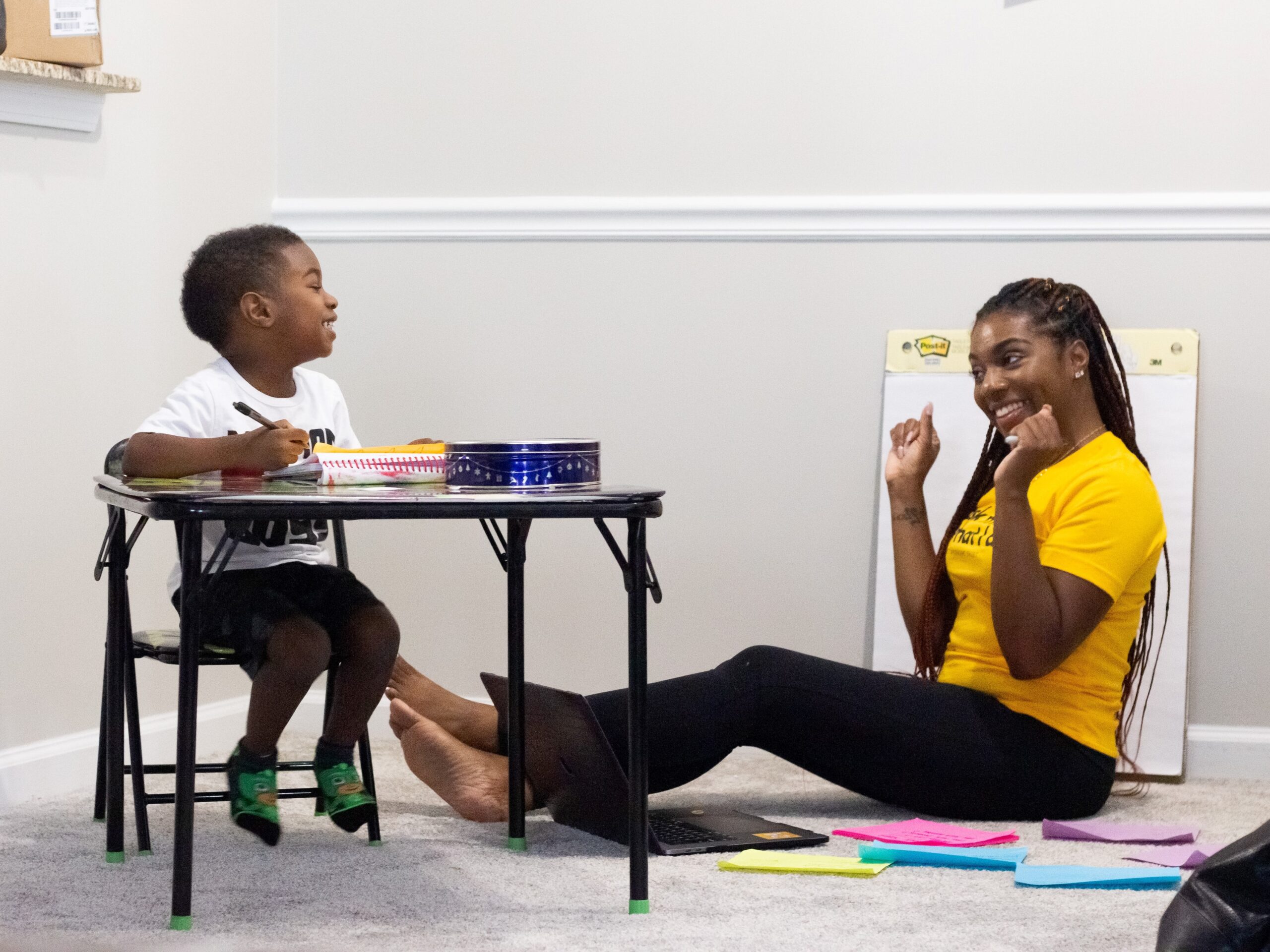 Teacher and student laughing