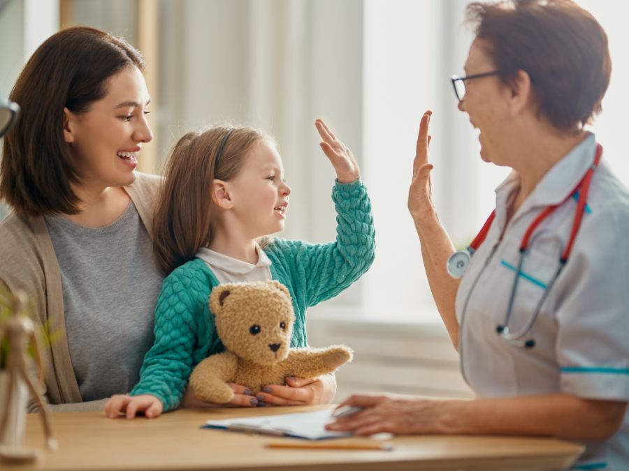 Doctor meeting with child and mother.