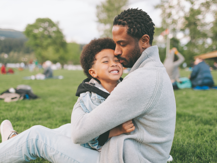 father and son hugging