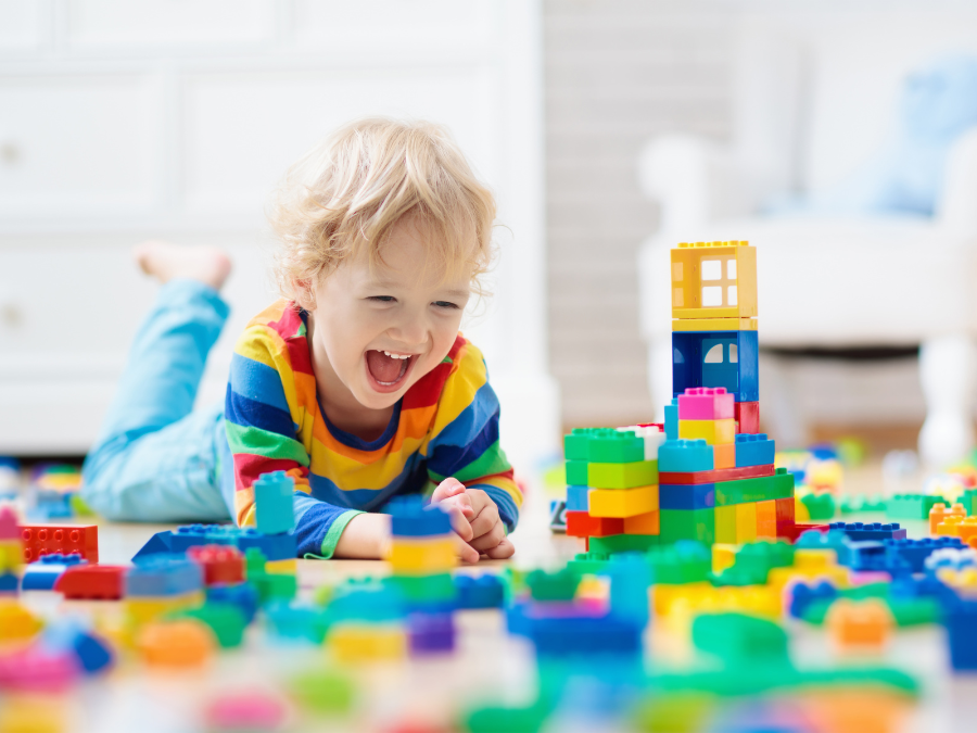 Child playing with building block toys.